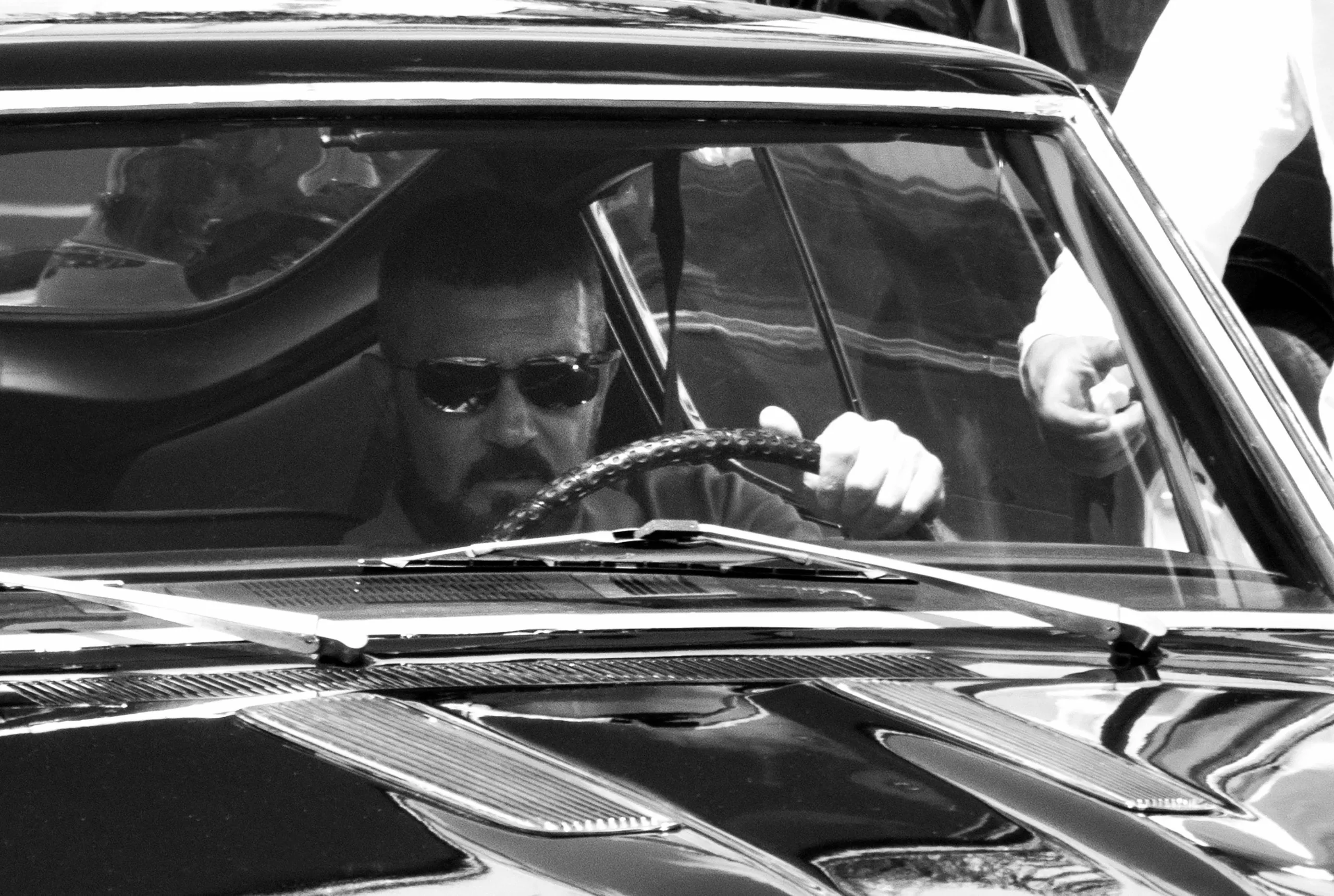 Antonio Banderas sitting in his car in The Enforcer Filming in Greece - Pictures by Alkis Ischnopoulos